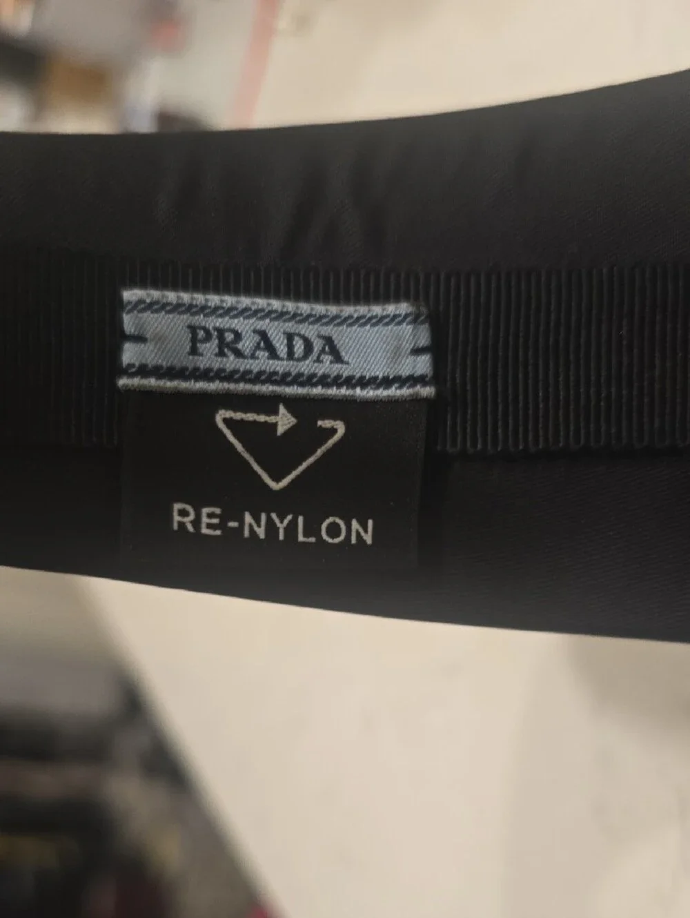 Prada Black Headband with Silver Triangular Logo